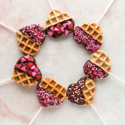 Heart shaped waffle pops for valentine's day in a circle. square crop