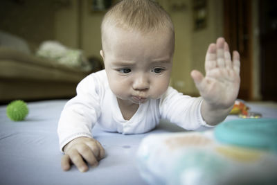 Close-up of cute baby boy at home