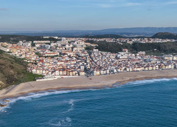 Nazare town in portugal. beach and cityscape. drone point of view.