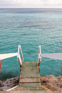 High angle view of steps leading towards sea