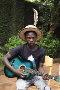 Full length of man playing guitar