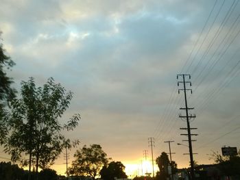 Low angle view of electricity pylon against sky