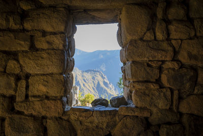 View of rocky mountains through window