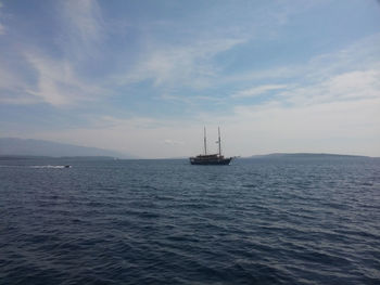 Boat at sea against sky