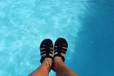 Low section of woman in swimming pool