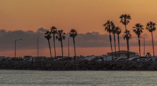 Scenic view of sea against orange sky