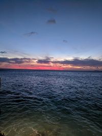 Scenic view of sea against sky at sunset