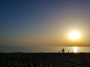 Scenic view of sea against clear sky during sunset