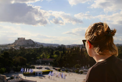 Woman looking at acropolis of athens