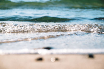 Close-up of waves rushing towards shore