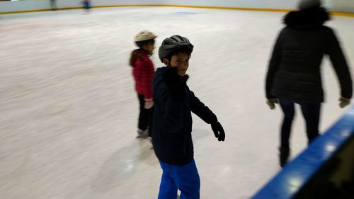 Portrait of boy ice skating 