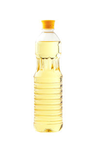 Close-up of glass bottle against white background