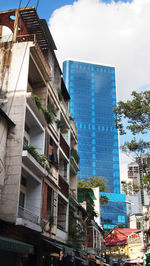 Low angle view of skyscrapers against sky