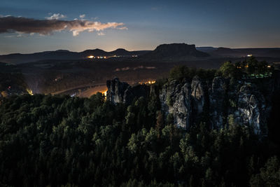 Scenic view of landscape against sky at night