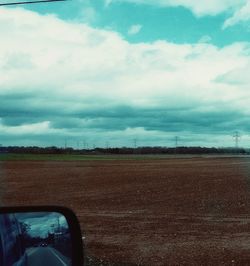 Road passing through field