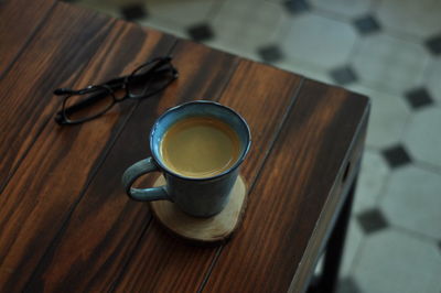 High angle view of coffee cup on table