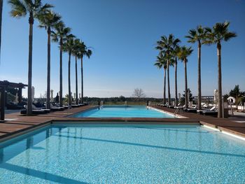 View of swimming pool against blue sky