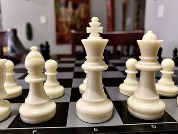 Close-up of chess pieces on table