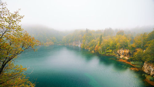 Scenic view of lake against sky during autumn