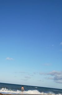 Scenic view of sea against blue sky