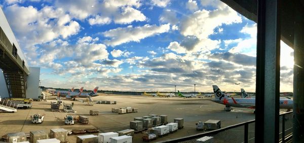 Panoramic view of airport runway against sky