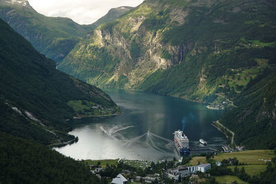 View from the top of the fjord to the harbor of geiranger and port cruiseship and ferry visible