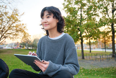 Young woman using mobile phone