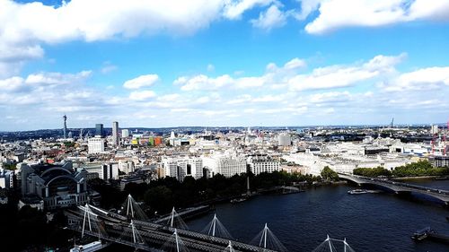 High angle view of bridge over river amidst buildings in city