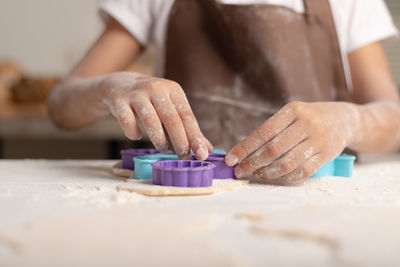 Midsection of man preparing food on table