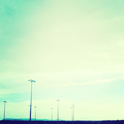 Low angle view of street light against blue sky