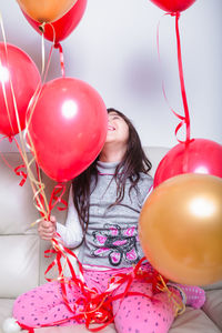 Midsection of woman with balloon balloons