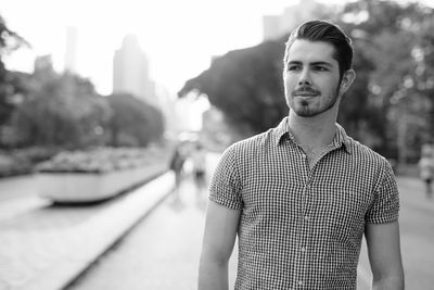 Portrait of young man standing outdoors