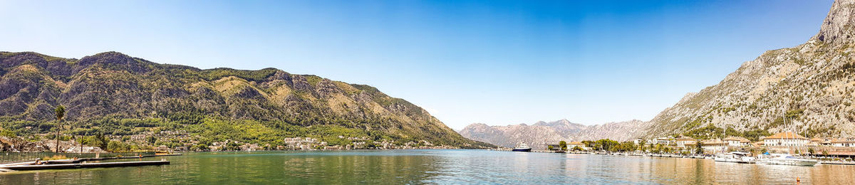 Panoramic view of sea and mountains against sky