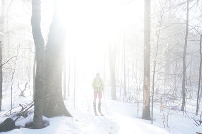 Woman on snow covered landscape