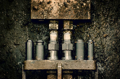 High angle view of rusty metal on wall