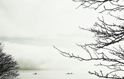 Scenic view of lake against sky during winter