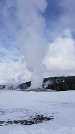 Scenic view of snow covered landscape against sky