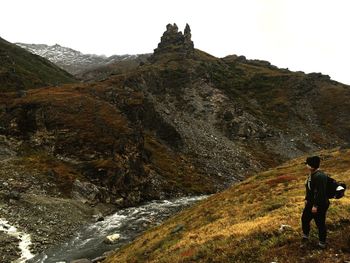 Tourist standing on mountain