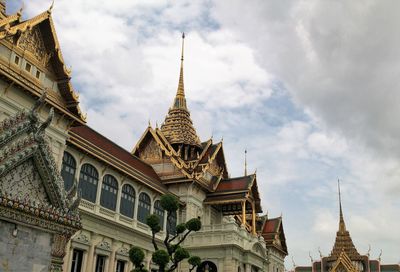 Low angle view of temple against cloudy sky