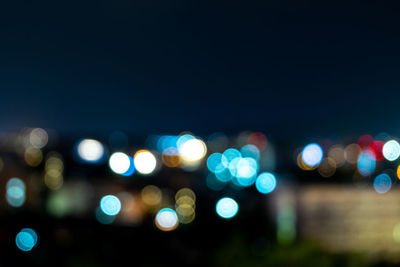 Defocused image of illuminated lights at night