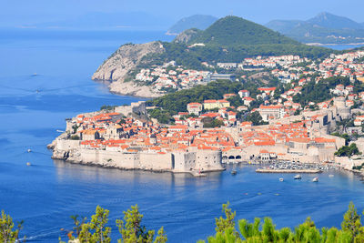 Aerial view of townscape by sea