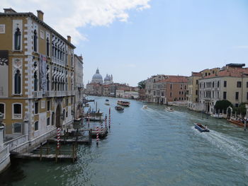 View of canal amidst buildings in city