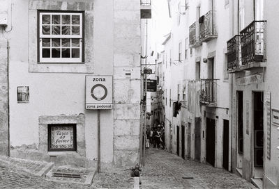 Alley amidst buildings in city