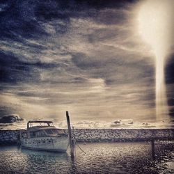 Scenic view of sea against cloudy sky