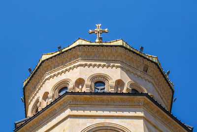 Low angle view of building against clear blue sky