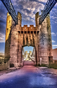 View of bridge against cloudy sky