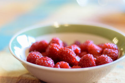 Close-up of strawberries in bowl on table