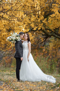 Bride standing in park