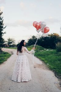 Woman standing on road