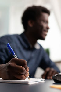 Young man sitting on table